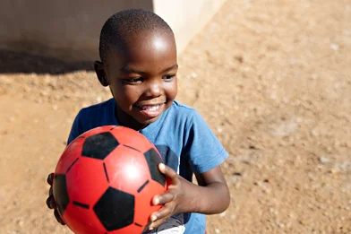 Happy boy with soccer ball