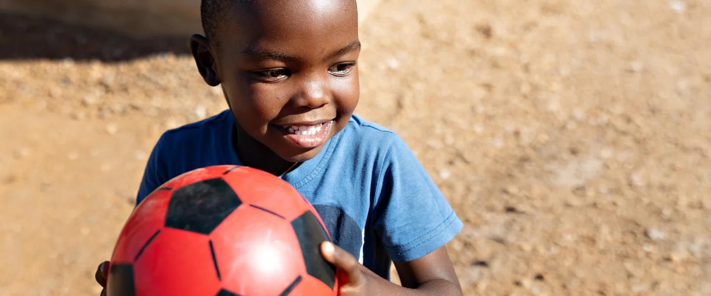 Happy boy with soccer ball